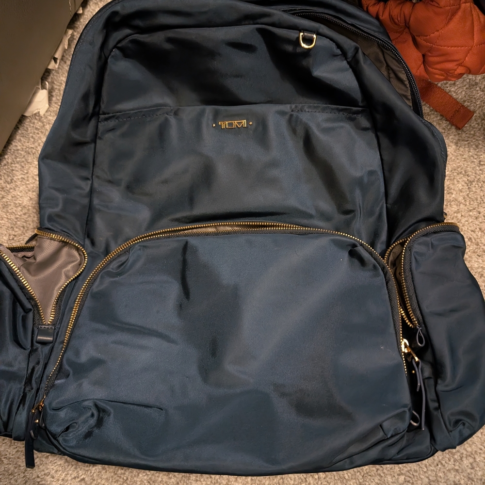 Tumi Voyageur Navy Blue Backpack with Gold Hardware